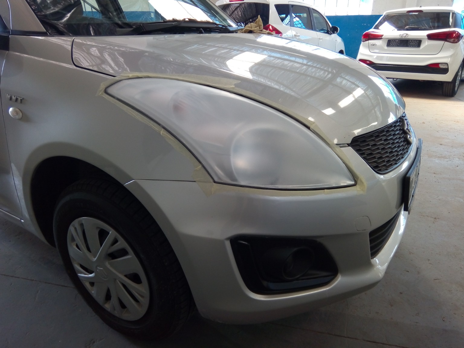 Cloudy Suzuki Swift headlight before restoration